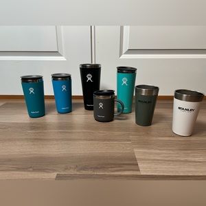 bundle of Hydroflask and Stanley tumblers